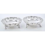 Pair of 1920s silver bonbon dishes of lobed circular form, with pierced decoration,