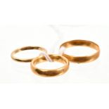 Three gold (22ct) wedding rings CONDITION REPORT Total gross weight approximately 10.