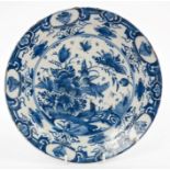 18th century Dutch Delft blue and white plate with painted Chinese-style bird, insect and flora, 22.