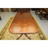 George III-style mahogany triple pedestal extending dining table,