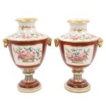 Pair early 19th century porcelain urn-shaped vases with painted floral reserves on iron-red ground