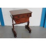 Early Victorian rosewood work table with rounded rectangular top over frieze drawer and