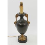 Continental classical revival bronze and ormolo table lamp of baluster form with flanking lion mask