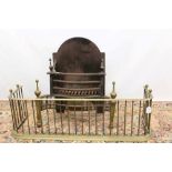19th century brass and iron serpentine fire basket, 62cm wide, with arched back and pierced apron,