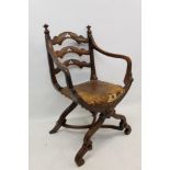 Early Victorian walnut open armchair by Gillow in the Gothic revival style with shaped trefoil