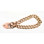 Edwardian yellow metal hollow curb link bracelet with padlock clasp CONDITION REPORT