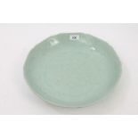Chinese celadon green glazed porcelain charger with incised leaf decoration - probably 19th century.