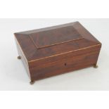 Regency mahogany and boxwood line-inlaid jewellery box of sarcophagus form raised on brass paw feet,