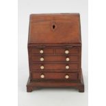 19th century mahogany miniature novelty bureau-form money box,