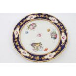 Early 19th century Derby plate with painted polychrome floral sprays,