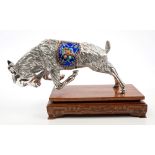 Unusual Far Eastern white metal model of a charging goat with cloisonné enamel saddle,