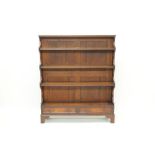 Early 19th century mahogany waterfall-front open bookcase with four graduated shelves and two