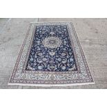 Nain rug, cream and wavy field with arabesque ornament within multiple meander borders,
