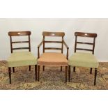 Pair of Regency mahogany elbow chairs with reeded and roundel horizontal bar backs and stuffover