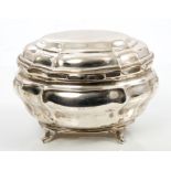 George V silver casket of bombe form, with fluted panels and hinged domed cover,