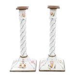 Pair of 18th century Staffordshire enamel candlesticks, each with associated square brass sconce,