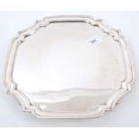 Contemporary silver salver of square form, with shaped corners and piecrust border,