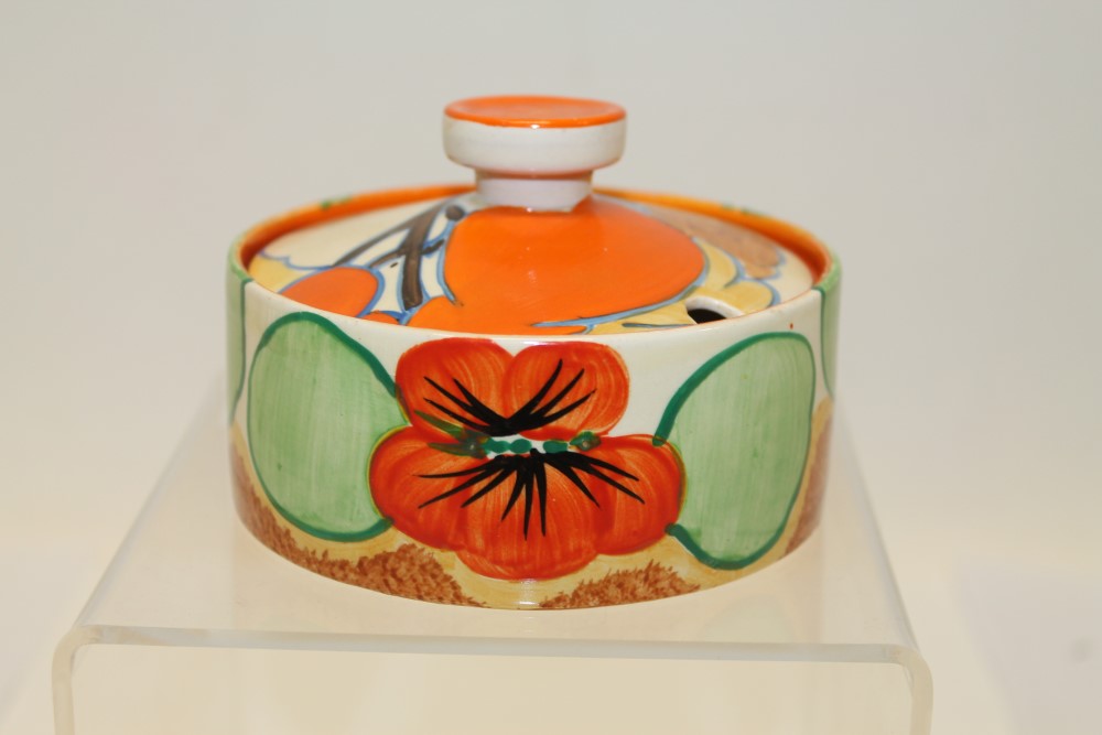 Clarice Cliff Nasturtium pattern preserve pot and cover of shallow form, printed marks to base, 7.