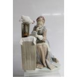 Large Lladro porcelain figure of a seated lady applying her lipstick