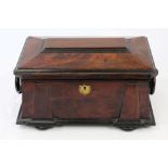 George IV mahogany tea caddy of classical sarcophagus form, with ring handles, on bun feet,