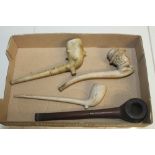 Three old clay pipes - including one in the form of a man's head and one other (4)