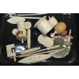 Collection of carved and turned bone sewing accessories - including shuttles, tape measures, clamp,