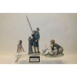 Three Lladro figures - girl feeding ducks, ballerina and man lighting street lamp,