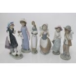 Six Lladro porcelain figures - girl with doll, girl with geese, girl with bird, girl with lamb,