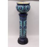 Burmantofts Faience blue glazed jardinière on stand with floral decoration - impressed marks to