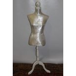 Contemporary mannequin on wooden stand