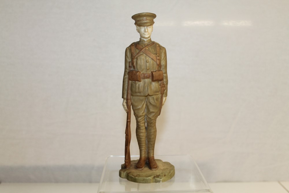 Rare Royal Worcester figure of a First World War soldier, standing with his rifle,