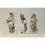 Three Lladro porcelain figures - girl with beach ball,