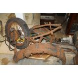 Selection of 1930s motorcycle parts - including girder forks, frame and two wheels, two tanks,