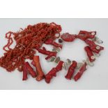 Collection of vintage natural bead coral necklaces and large pieces of natural coral made into a