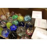 Three boxed Caithness glass paperweights and a selection of other paperweights (28)