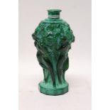 Unusual green scent bottle decorated with moulded nude female figures,