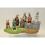 Royal Doulton Bunnykins The Robin Hood Collection set - comprising stand, Friar Tuck, Maid Marion,