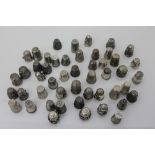 Collection of antique silver and white metal thimbles - each with various raised ornament