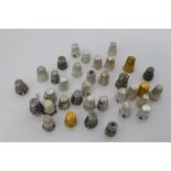 Collection of antique filigree and pierced silver and white metal thimbles (approximately 35)