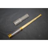 Three-draw telescope with leather cover and cloth covered storage tube,