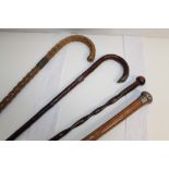 Three early 20th century silver mounted walking canes (Birmingham 1908 and London 1911),