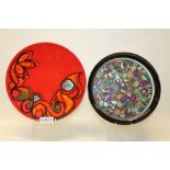 Poole Delphis charger with abstract decoration on red ground,