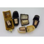 Five various cased antique yellow metal thimbles.