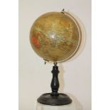 Early 20th century Geographia 8 inch terrestrial table globe on a turned ebonised stand