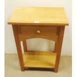 Solid oak, one dr. occasional table.