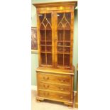 Slimline yew wood bookcase with brush slide