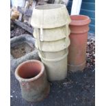 A fluted chimney pot and two further similar