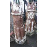 A pair of 3' 11" Victorian "The Champion" crowned chimney pots