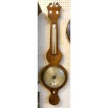 An antique mahogany and boxwood strung barometer/thermometer with silvered dial and scale, bone