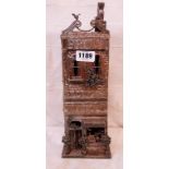 A 13 1/2" Ian Gregory salt glazed hand built and modelled building, the Emporium